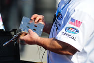 NASCAR Cup Series officials hand out restrictor plates in the garage at Daytona. Source: Imagn